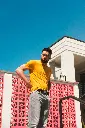 unsplash_7wXPZHhyORA_yellow tshirt.webp.jpg.jpg.jpg